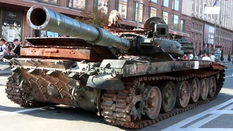 Burned tanks and war machine on a central street of city. Stock Footage 214459546