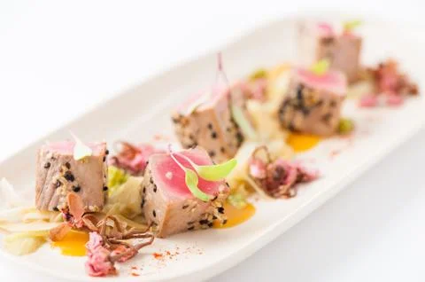Burned tuna with herbs Stock Photos