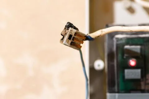 Burned wire, splicing connector, electrical terminal block of nonflammable, f Stock Photos