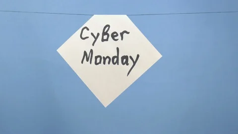 Burning and smoking white sheet of paper with a black inscription "cyber monday Video stock 124728076