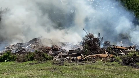 Burning ashes of a home smouldering Stock Footage 339801829