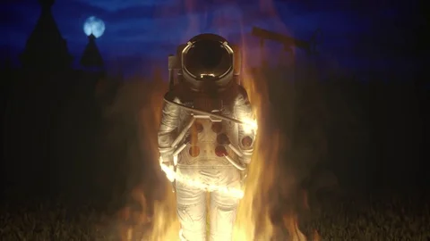 Burning astronaut on inquisition bonfire Stock Footage
