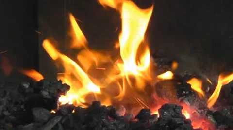 Burning barbecue coals create dancing flames. Video stock 34631980