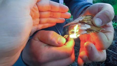 Burning the bark of a tree for a fire Stock Photos