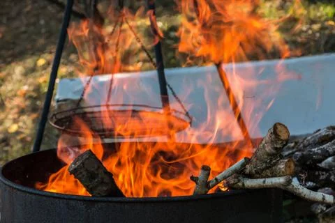 Burning barrel in the middle of the garden Stock Photos
