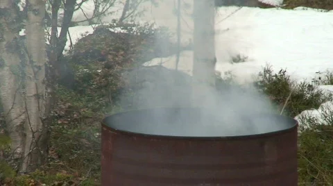 Burning in a barrel two Stock Footage 77341