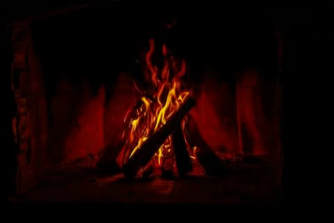 Burning billets in fire-box of fireplace 스톡 사진