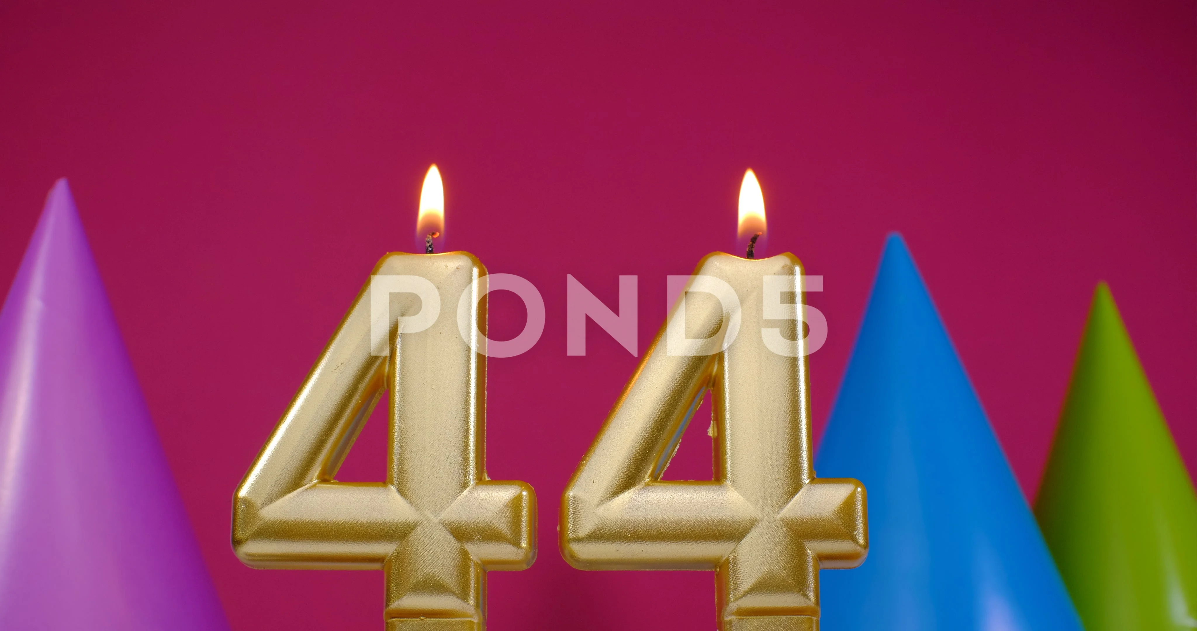 Burning birthday candles number 44 Stock Photo - Alamy