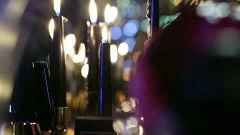 Burning black candles with many reflections and lights Stock Footage 131378821