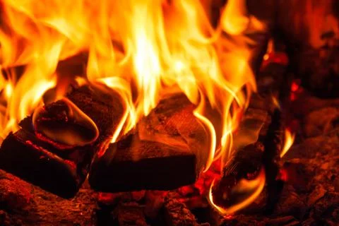 Burning boards in the fireplace, open flame Stock Photos