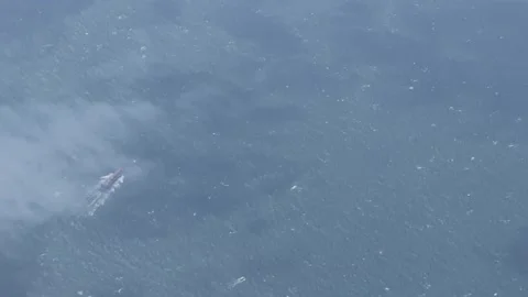 Burning Boat on Open Ocean Stock Footage 335411542