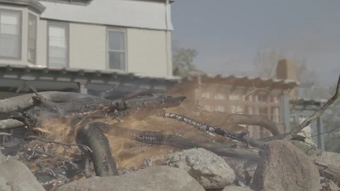 Burning a body on a fire pit in a plastic bag Stock Footage 91480352