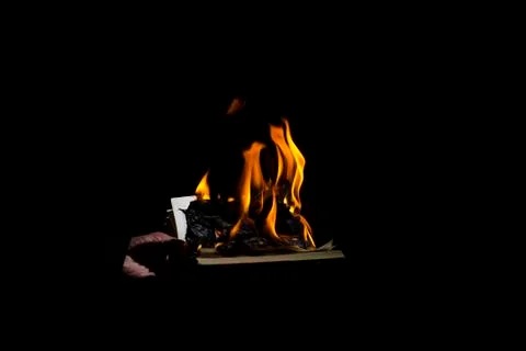 Burning book on a black background Stock Photos
