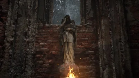 Burning Brazier Illuminates a Mourning Angel Statue in Gothic Ruins Stock Footage 340957625