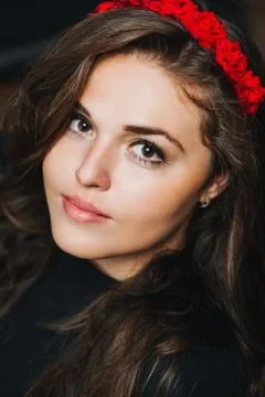 Burning brunette on a black background Stock Photos