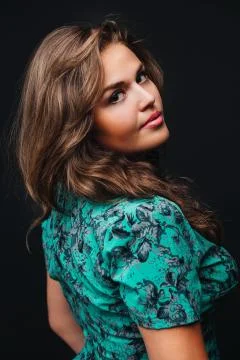 Burning brunette on a black background Stock Photos