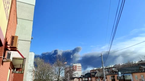 Burning building after the bomb attack in ukrainian city. Video stock 181442804