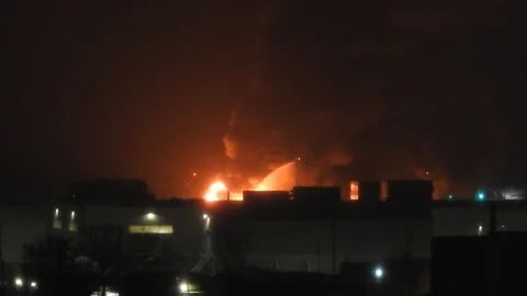 Burning Building At Night With Firetrucks Hosing Down Building 2 Stock Footage 88939670