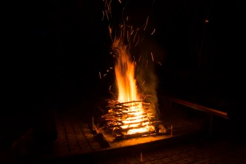 Burning camp fire at dark night Stock Photos