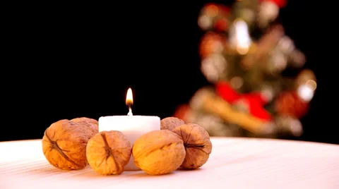 Burning candle and walnuts Stock Footage 32555727