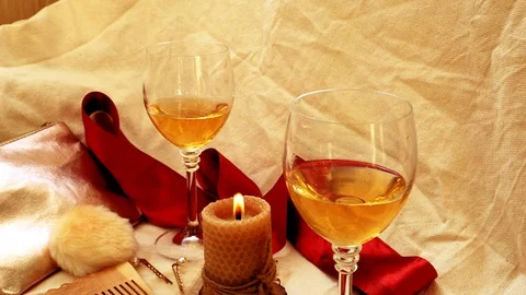 Burning candle and wine Stock Footage 128889963