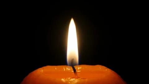 Burning candle on a black background 스톡 동영상 122210787