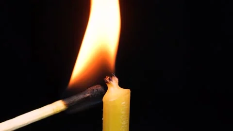 Burning candle on a black background Stock Footage 144890167