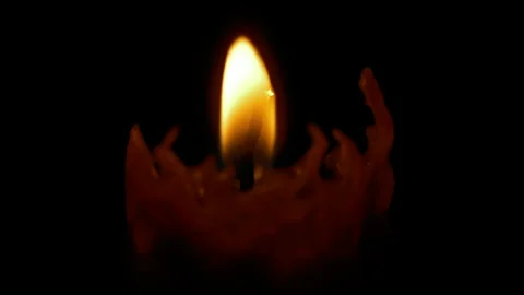 Burning candle on black background Stock Footage 259376563