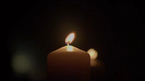 Burning candle on a black background Stock Footage 265176553