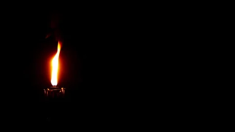 Burning candle on a black background. Stock Footage 285769891