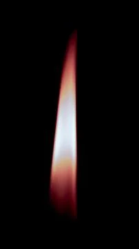 Burning candle on black background Stock Photos