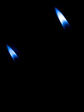 Burning candle on black background Stock Photos
