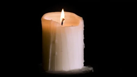 Burning candle on black Stock Footage 95088071