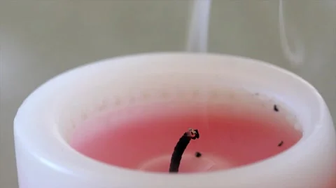 A Burning Candle is Blown Out Leaving Only Smoke Stock Footage 10946276