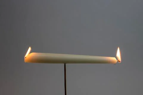 Burning the candle at both ends Stock Photos