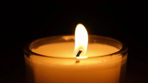 Burning candle close up on a black background. Slow motion video. Stock Footage 146791337