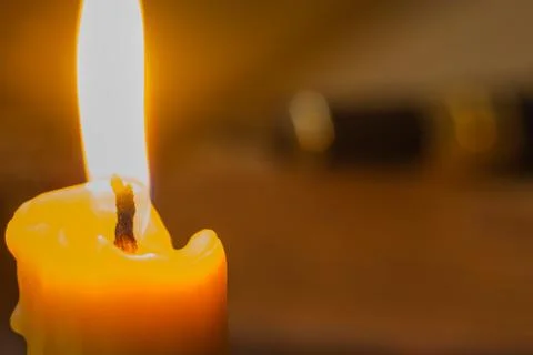 Burning candle close-up Stock Photos