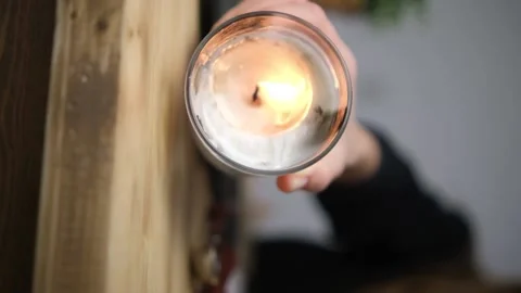 Burning candle. close-up view of the candle that is rolling on the table. The ve Video stock 147546205