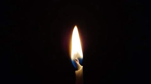 Burning candle closeup in the black background Stock Footage 317900974
