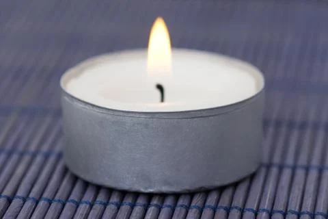 Burning candle closeup Stock Photos