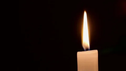 Burning Candle on dark background with copy space at left part of picture Stock Footage 74496309