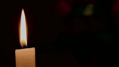 Burning Candle on dark background with copy space at right part of picture Stock Footage 74496460