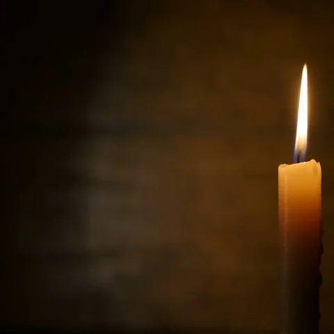 Burning Candle on a Dark Background Stock Footage 69378125