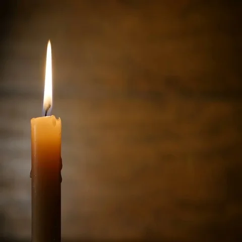 Burning Candle on a Dark Background Stock Footage 69378543