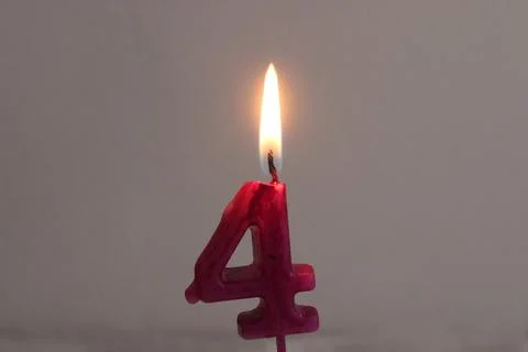 Burning candle in dark background Stock Photos