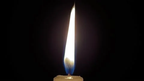 Burning candle on a dark background. Romantic evening. Video stock 199837262