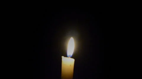 Burning candle in the dark Stock Footage 58609906