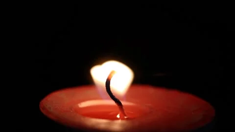Burning candle in the dark Video stock 165610430