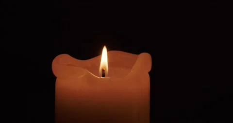 Burning candle in the dark Stock Footage 227042590