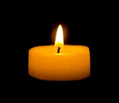 Burning candle in the dark Stock Photos